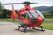 Red air ambulance helicopter registration G-WASC