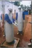 Nurse being sprayed with chlorine while leaving the isolation ward.