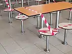 Tables and seats cordoned off with tape
