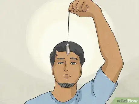 Immagine titolata Clear Your Chakras with a Pendulum Step 5