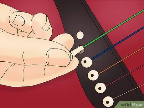 Immagine titolata String an Acoustic Guitar Step 10