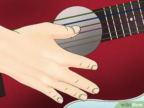 Immagine titolata String an Acoustic Guitar Step 16