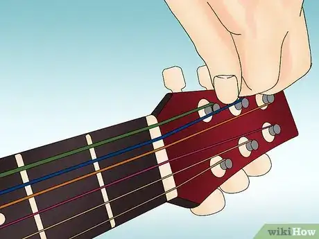 Immagine titolata String an Acoustic Guitar Step 11